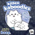 Kitten Kaboodles accessory packaging with two white cats and 'Smirk & Dagger' branding on a dark background.
