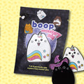 Boop mystery pin package with cute cat-themed pins on a yellow background