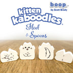 Kitten kaboodles toy figures with 'boop by Scott Brady' branding on a wooden surface.