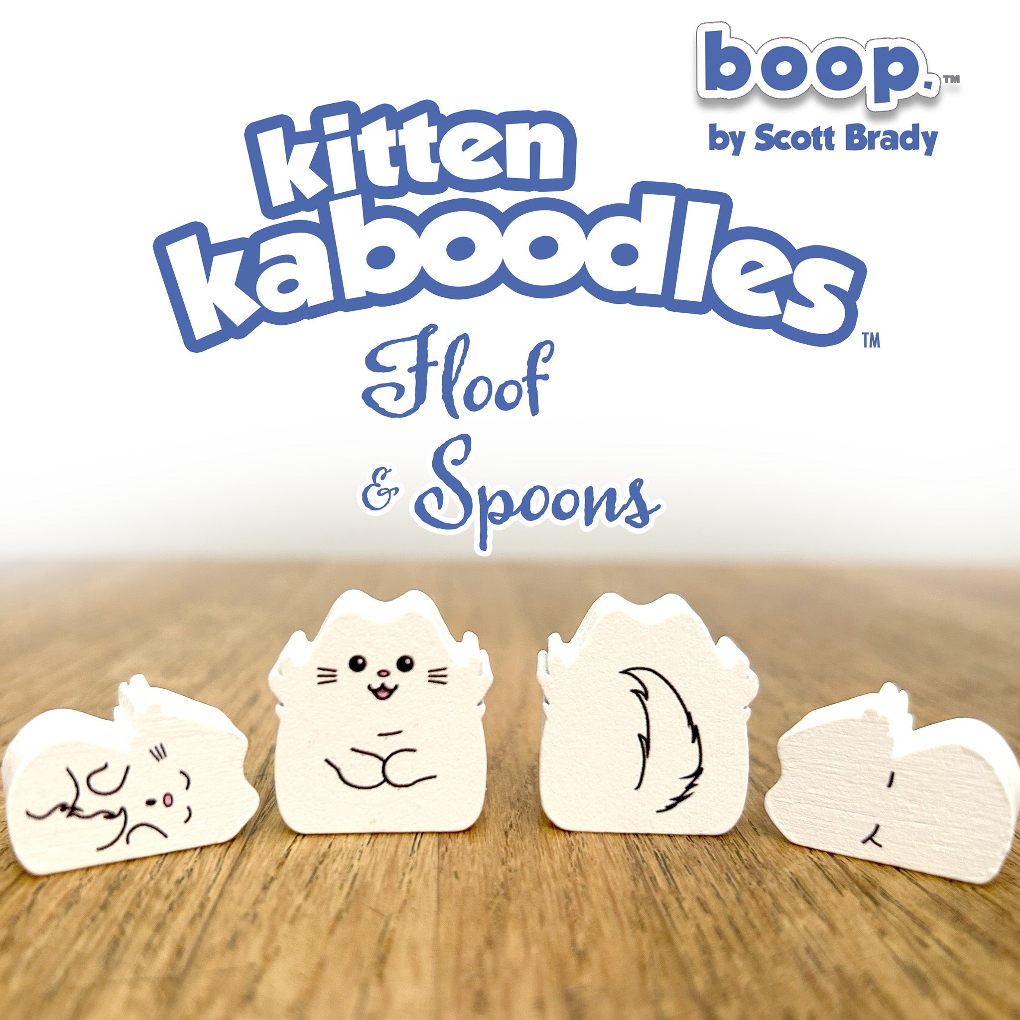 Kitten kaboodles toy figures with 'boop by Scott Brady' branding on a wooden surface.
