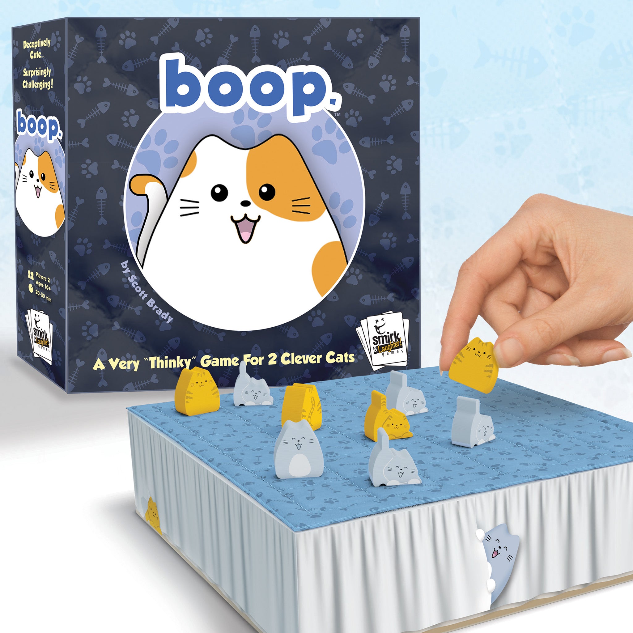 Board game 'boop' with cat-themed pieces and packaging on a light blue background