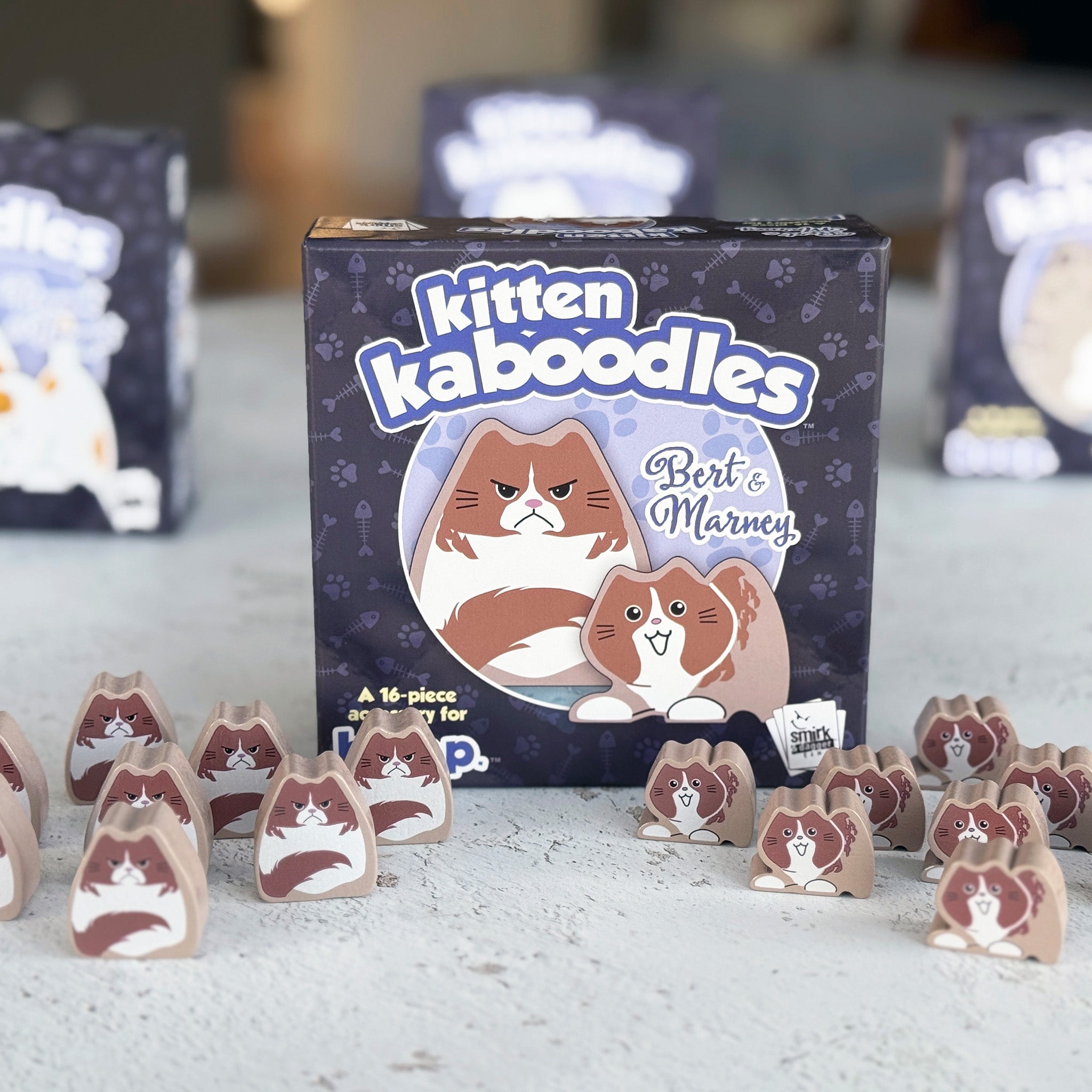 Kitten Kaboodles game box with cat-themed pieces on a surface