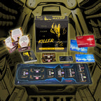 Card game components including cards and a box with a alien illustration on a dark background.