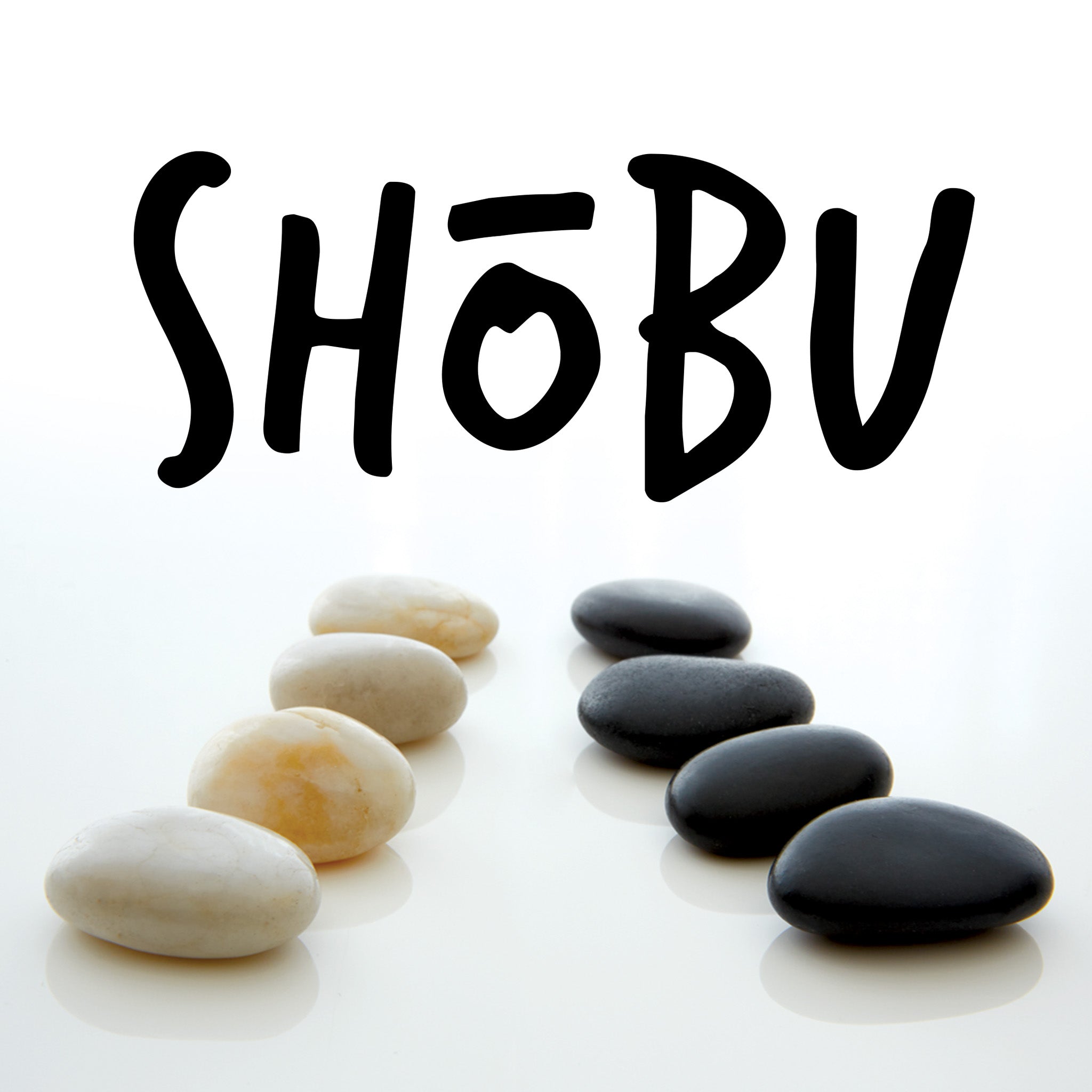 Black and white stones arranged in a pattern with 'SHÜbu' text above on a white background
