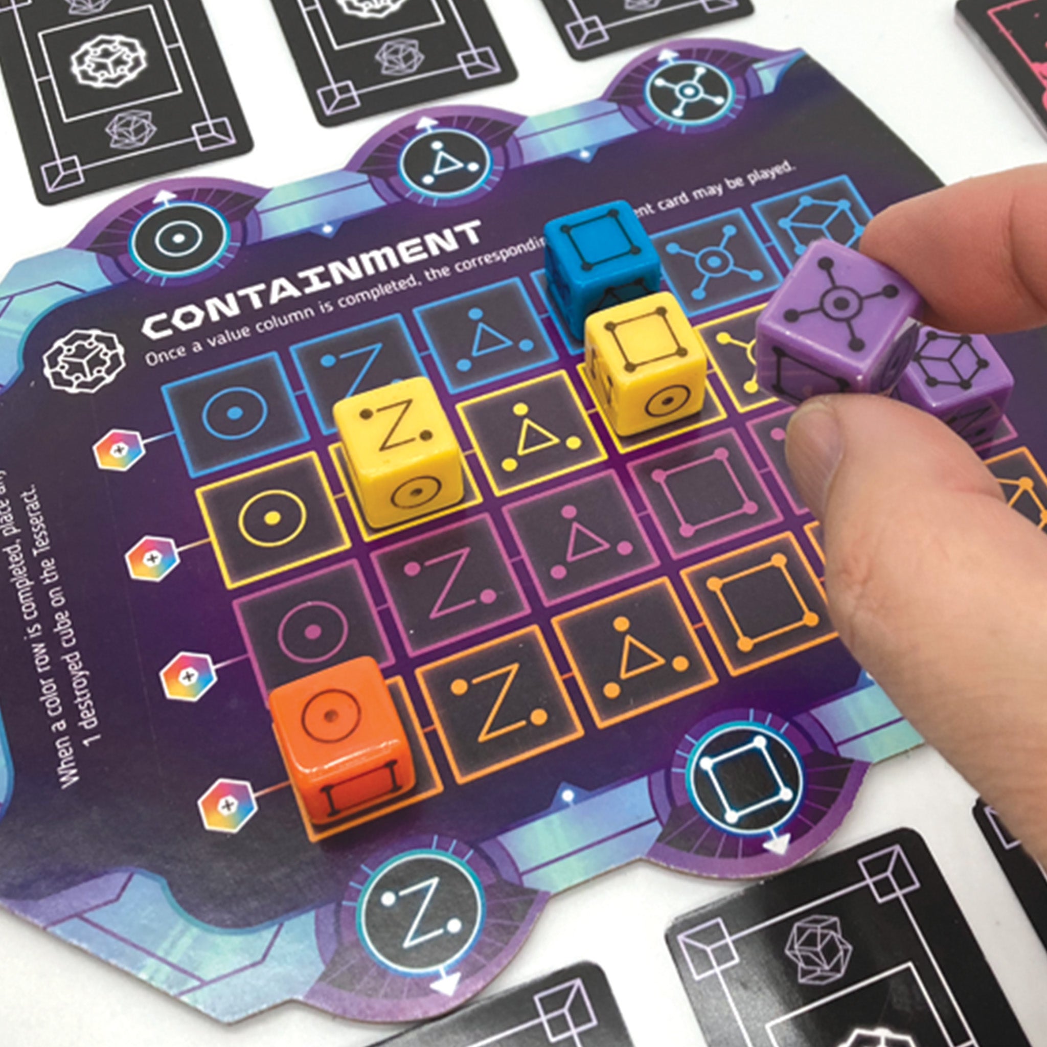 Board game component with colorful cubes on a 'Containment' card