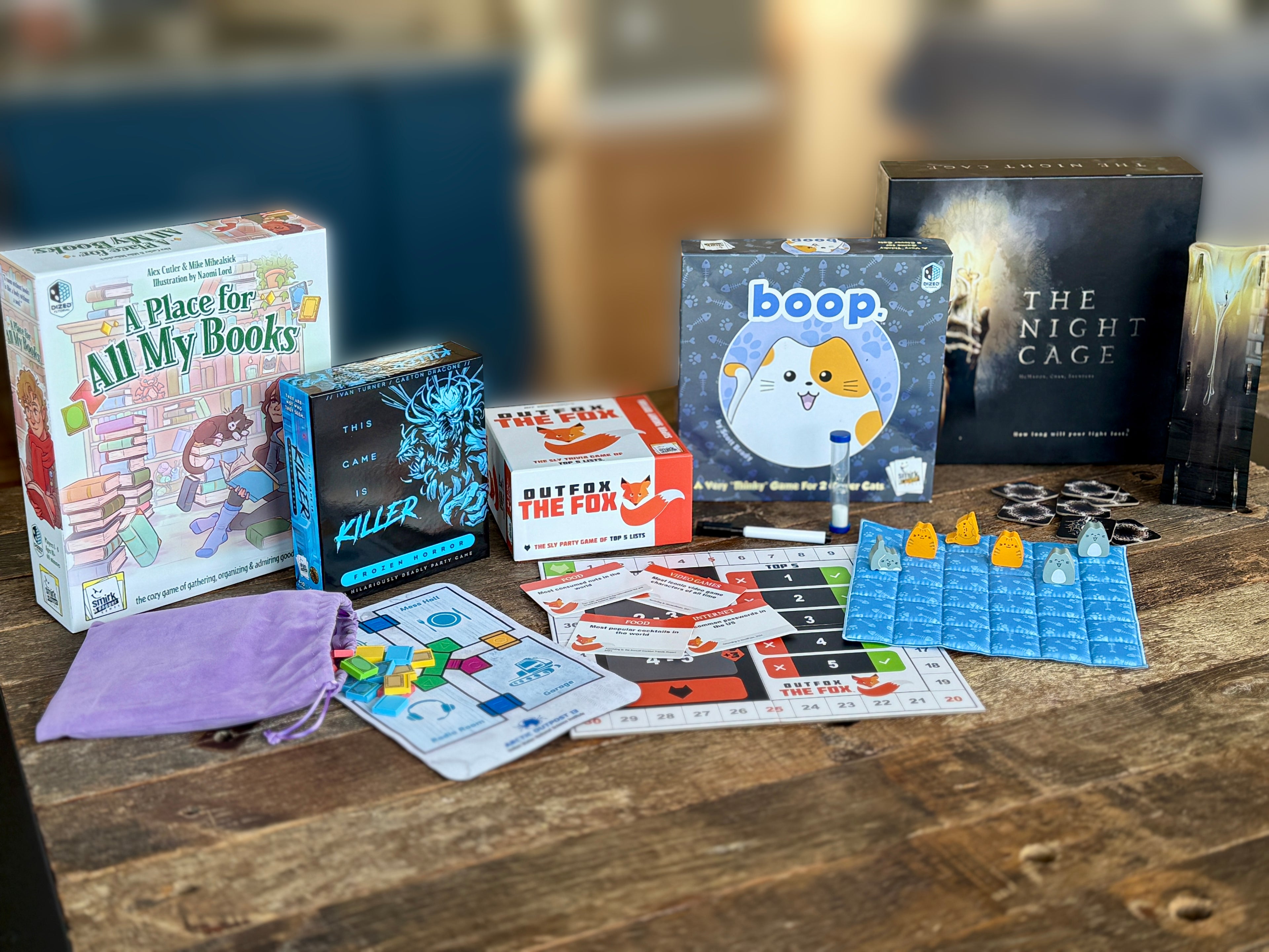 Table of Smirk and Dagger Board Games